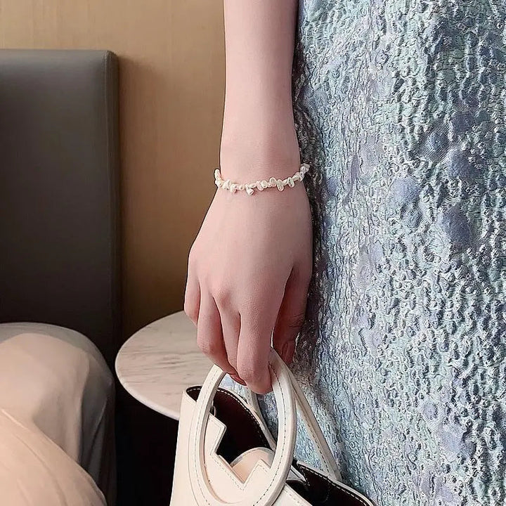 Céline Bransoletka z pereł - Ponadczasowa elegancja w lśniących perłach