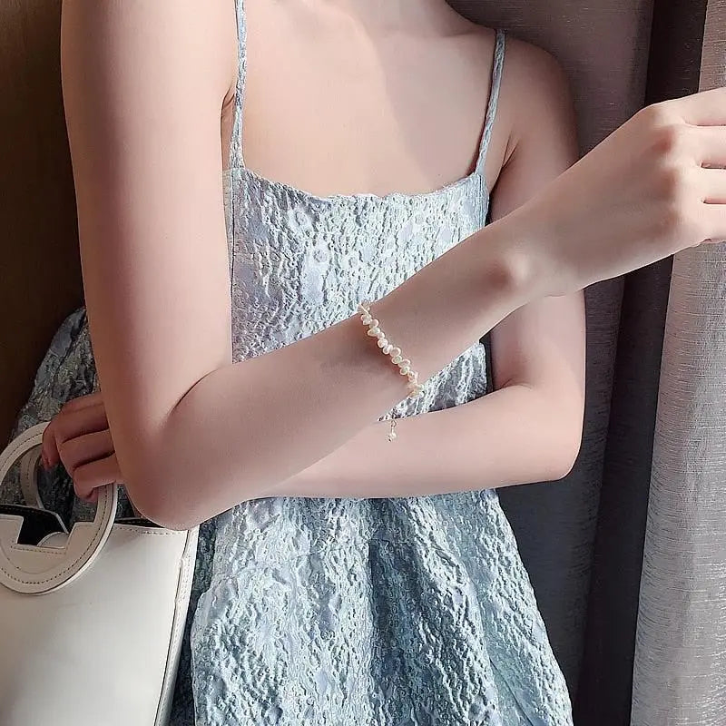 Céline Bransoletka z pereł - Ponadczasowa elegancja w lśniących perłach