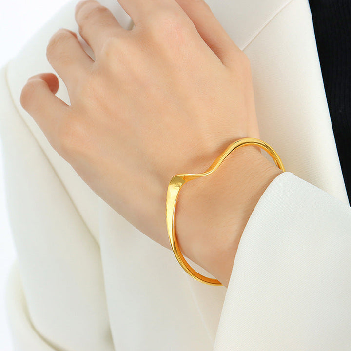 Iris Złota Bransoletka Bangle - Ponadczasowa Elegancja w Złotym Odcieniu